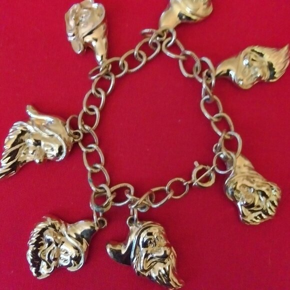 A beautiful child size Gold plated Snow White Seven dwarf's Avon bracelet